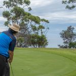 Aung playing golf at Mollymook